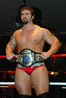 Phill Shatter with the NWA Anarchy Heavyweight Championship.