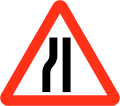 Road narrows on left sides