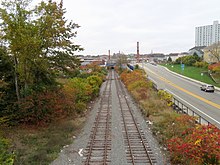 A two-track railway line in an urban area