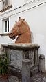 La cabeza del caballo en terracota.