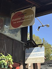 Metal signs at a plant nursery in Los Angeles County, California marketing Mastercharge and Bankamericard Mastercharge and Bankamericard.jpg