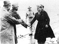 Major General Pedro del Valle (second from left) is greeted by Colonel "Chesty" Puller on Pavuvu in late October 1944, while Major General William H. Rupertus (far left) looks on