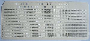 An actual punch card with a line of COBOL prog...