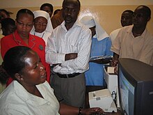 A woman employee demonstrates a hospital information management system in Tanzania. Tanzania hospital information mgt system.jpg