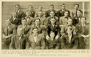 Twenty-two men and one boy wearing dark suits