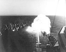 US Navy personnel aboard aircraft carrier USS Essex (CV-9) flee as McDonnell F2H-2 Banshee strikes parked aircraft and explodes; 16 September 1951. 1951 Essex crash 1.jpg