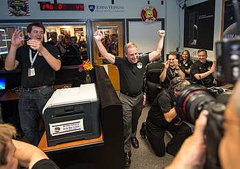 Alan Stern celebrating the successful flyby of the Pluto system by New Horizons in 2015 in the APL Mission Operations Center. Alan Stern and New Horizons Team Celebrate Pluto Flyby.jpg