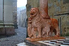 Detail of one of the lions supporting the columns of the right transept porch.