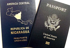 English: A dual citizen may bear two passports...