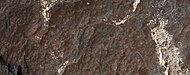Close view of light-toned materials, as seen by HiRISE under HiWish program. Light-toned materials have been associated with water.
