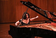 Khatia Buniatishvili playing a grand piano Khatia Buniatishvilli08 (48467004567).jpg