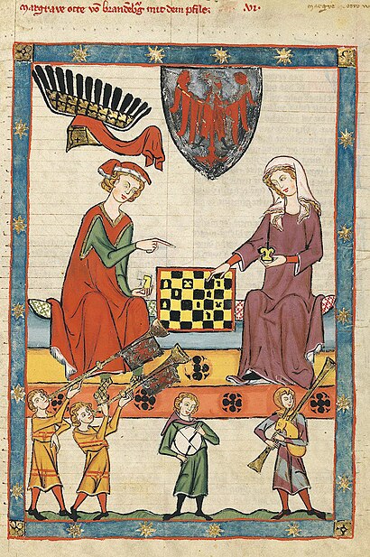 male and female playing chess