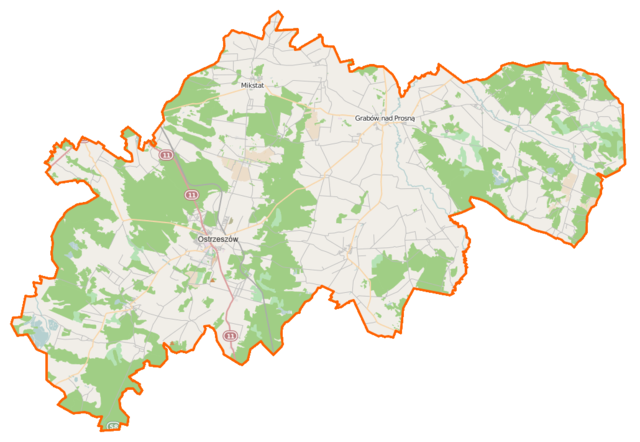 Mapa konturowa powiatu ostrzeszowskiego, u góry znajduje się punkt z opisem „Prokatedra Narodzenia Najświętszej Maryi Panny”