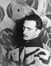 A grayscale 1939 photograph of painter Salvador Dalí