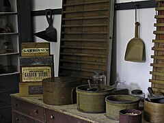 Shaker seed room showing preparation for fill measuring of envelope "papers"