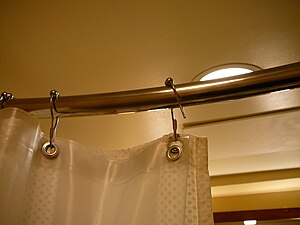 English: Shower curtain rod and hooks in the M...