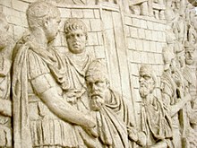 Trajan receives homage from a Dacian chieftain, plaster cast from Trajan's Column Traj col homage 3.jpg