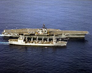 USS Kalamazoo (AOR-6) replenishes USS Saratoga (CV-60) in the Atlantic Ocean on 23 June 1993.jpg