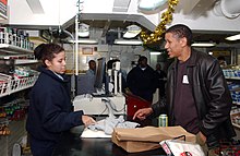 US Navy 041211-N-6536T-074 Television actor Scott Lawrence purchases souvenirs from the ship's store during a visit to the aircraft carrier USS Nimitz (CVN 68).jpg