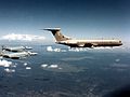 A pair of F-4J(UK)s form alongside a VC10 of 101 Squadron