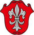 Gemeinde Oberpleichfeld In Rot eine silberne heraldische Lilie.