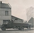 Náměstíčko vedle Fricova mlýna s nákladním automobilem stojícím před pro něj postavenou garáží, bez data (40. léta 20. století)