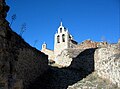 Vista de la iglesia de Santa María la Mayor en Moya (Cuenca), desde la Bajada de la Puerta de los Ojos. Siglo XV.