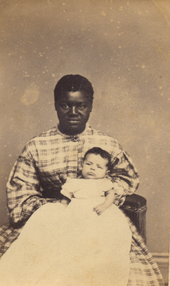 Slave woman tending to a white baby in West Virginia, 1865 Aunt Susan, a slave woman tending a white baby.png