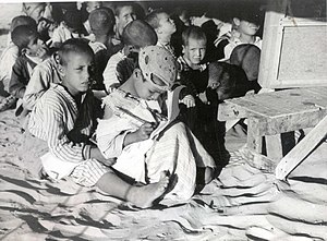 children boy and sister in makeshift School fo...