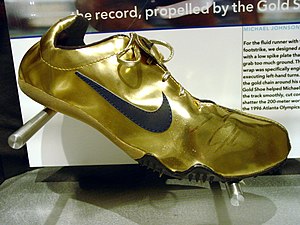 English: Golden shoes Michael Johnson Nike tow...