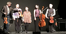 On stage with Laurie Anderson, after performing LANDFALL at the Harris Theater on March 17, 2015 Laurie Anderson amidst the Kronos Quartet in Chicago after performing LANDFALL 2015-03-17 20.53.41 (16851029595).jpg