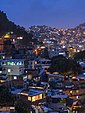 Informal settlements built into the hillside in Rocinha, Rio de Janeiro, Brazil at dusk
