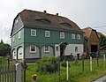 Wohnstallhaus (Umgebinde) und Nebengebäude (Holzkonstruktion)