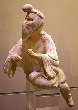 An 8th century Tang dynasty Chinese clay figurine of a Sogdian man wearing a distinctive cap and face veil, possibly a camel rider or even a Zoroastrian priest engaging in a ritual at a fire temple, since face veils were used to avoid contaminating the holy fire with breath or saliva; Museum of Oriental Art (Turin), Italy. Dinastia tang, shanxi, straniero dal volto velato, 600-750 ca.JPG