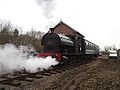 The Pecket and passenger coach passes the goods shed during the Whitwell station reopening