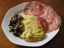 Polenta served with sopressa
and mushrooms, a traditional peasant food of Veneto Polenta con sopressa e funghi.jpg