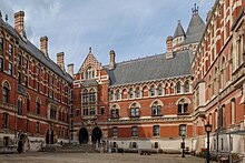 The Royal Courts of Justice is on the Strand in London. Together with its adjacent Thomas More Building and its outpost Rolls Building on Fetter Lane, it is the main seat of the High Court of Justice and the ordinary seat of the Court of Appeal. Royal Courts of Justice Quadrangle September 2023.jpg