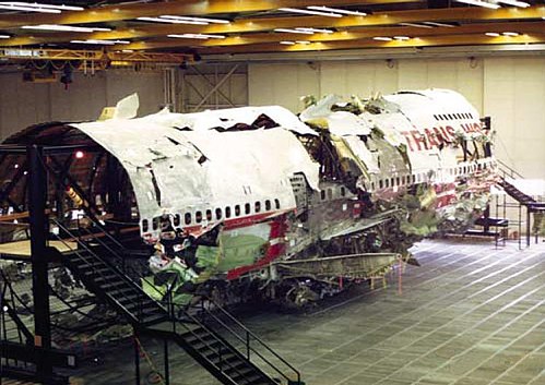 The reconstructed wreckage of TWA Flight 800 inside a hangar at Calverton Executive Airpark, New York state TWA800reconstruction.jpg