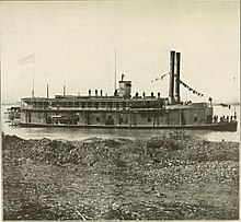 Sepia toned photo shows a river steamboat with two smokestacks and the number 8 on the pilot house.