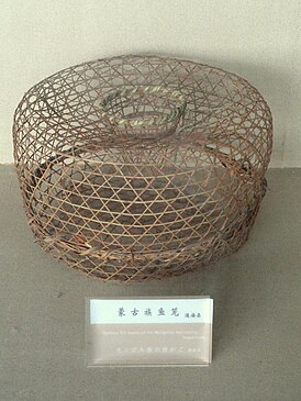 Mongolian bamboo fish basket. Tools and utensils in the Yunnan Nationalities Museum, Kunming, Yunnan, China.