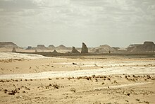 In the far future, most of Earth's land will likely be a barren desert, like this location in White Desert National Park, Egypt. White Desert, Stark desert landscape, Rock formations, Egypt.jpg