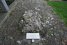 Pile of stones marked with a tag reading "St. Augustine, Site of Grave, First Archbishop of Canterbury"