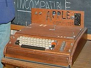 The Apple I, Apple's first product. Sold as an assembled circuit board, it lacked basic features such as a keyboard, monitor and case. The owner of this unit added a keyboard and a wooden case.
