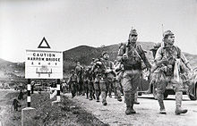 Japanese troops crossing the border from the mainland, 1941 Battle of HK 01.jpg