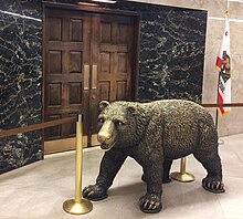 Bronze statue of a California grizzly bear outside the governor's office, in the California Capitol. California Grizzly Bear Statue Capitol Museum (cropped).jpg
