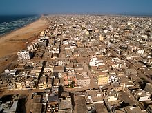 Aerial view of Yoff Commune, Dakar Dakar Roofs - Beach & Ocean (5651584098).jpg