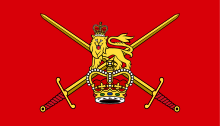 A flag with a red field. The central device is a lion wearing a crown and standing on a larger crown, superimposed on a pair of crossed swords; all predominantly in yellow