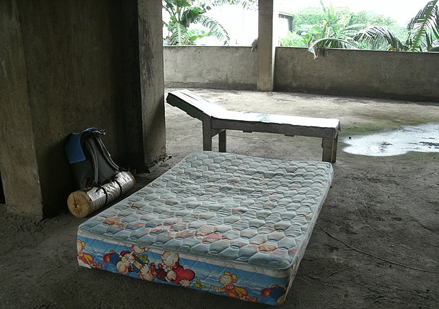 The second (vacant) floor of an unfinished building housing a community of homeless people. Jakarta, Indonesia. (Photo from book by Pinchuk Viktor ""Six months by islands... and countries"")