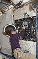 NASA image: ISS018E35752 Sandra Magnus as she works with the Combustion Integrated Rack (CIR) in the U.S. Laboratory, Destiny, during maintenance.