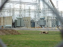 A 50 Hz electrical substation in Melbourne, Australia, showing three of the five 220 kV/66 kV transformers, as well as high-voltage transformer fire barriers, each with a capacity of 150 MVA. This substation uses steel lattice structures to support strain bus wires and apparatus. Melbourne Terminal Station.JPG